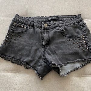 Black denim studded shorts